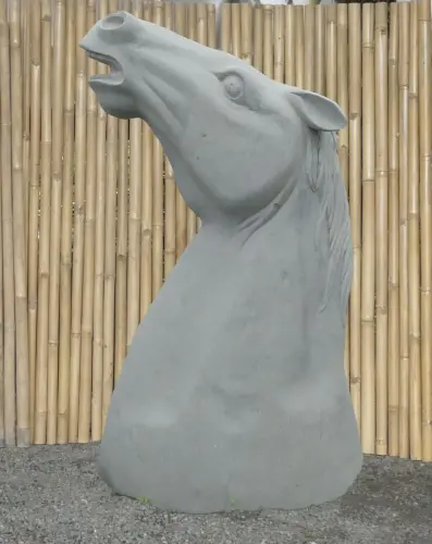 Product image of the product “Head of a Horse made from Riverstone, looking up. 190cm Height. ”
